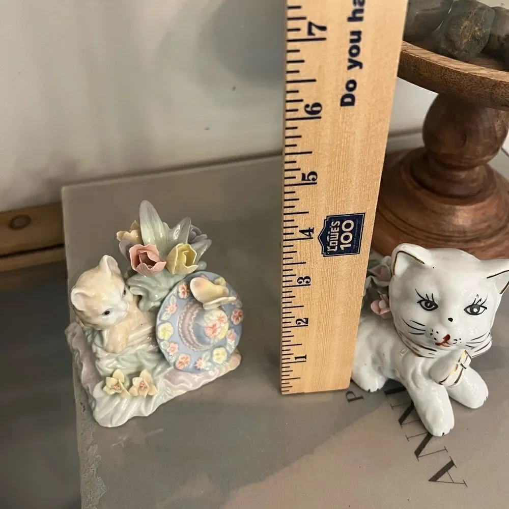 Set of two vintage small ceramic white and floral cats.